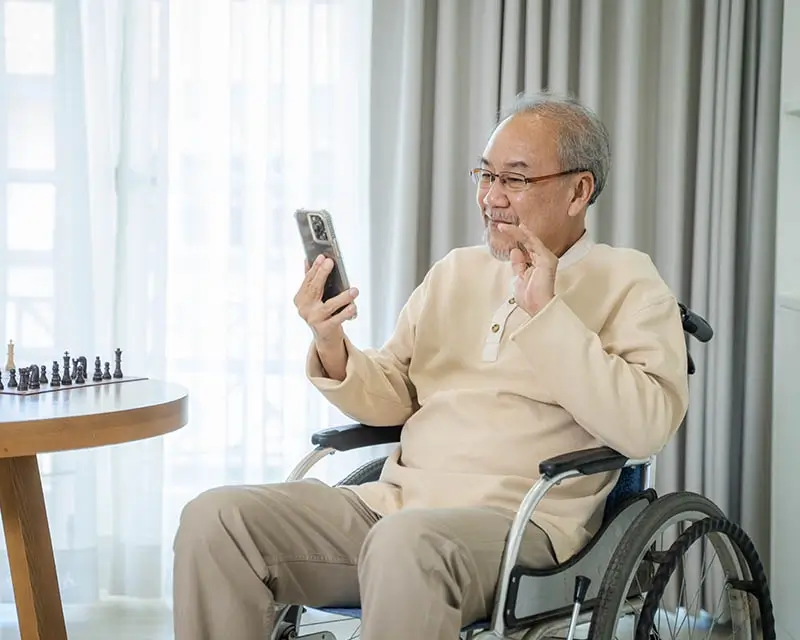 Disabled patient in a video meeting through Curoflow telemedicine mobile app