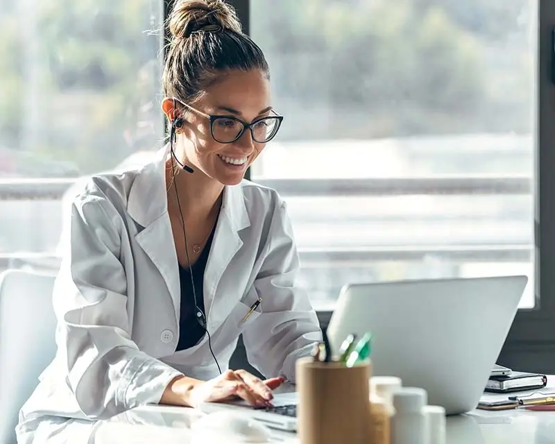 Doctor at county hospital in video meeting with patient through Curoflow telemedicine platform